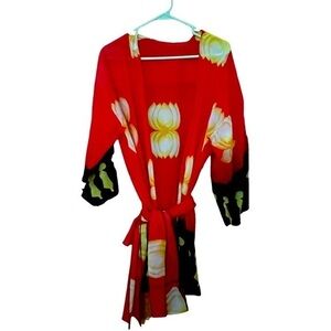 Kimono with belt.  Red with yellow lotus and geishas at the bottom.